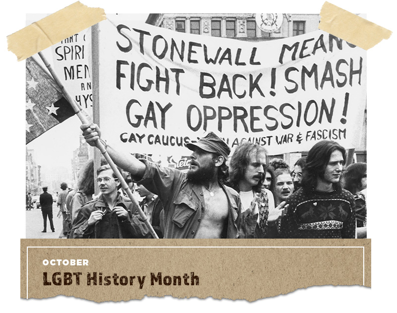 black and white photo of people marching with a sign that says 'stonewall means fight back! smash gay oppression!'