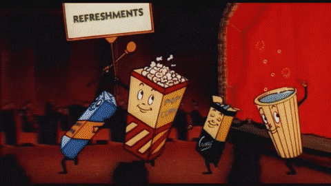 gif of snacks dancing along a movie theater aisle