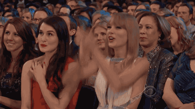 gif of Taylor Swift clapping and cheering from an audience