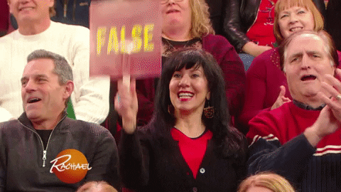 woman holding a sign that says