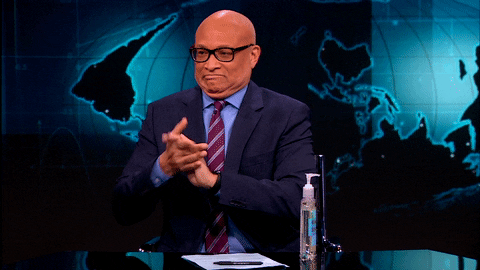 gif of Larry Wilmore using hand sanitizer 