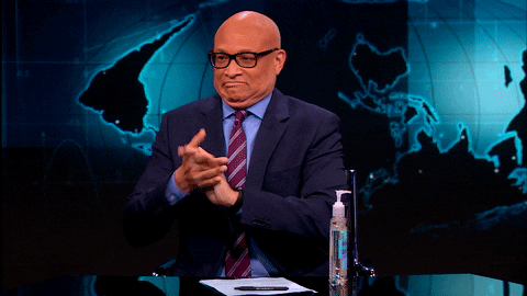 gif of Larry Wilmore using hand sanitizer