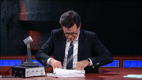 gif of Stephen Colbert flipping through papers