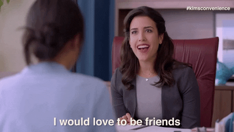 gif of a woman in a business suit saying 'I would love to be friends'
