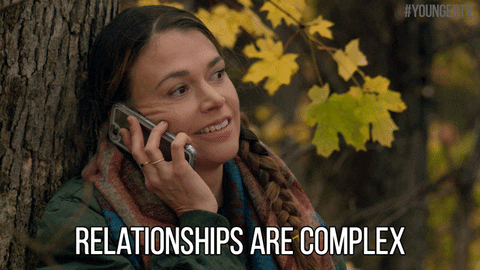 gif of a woman on her cell phone saying 'relationships are complex'