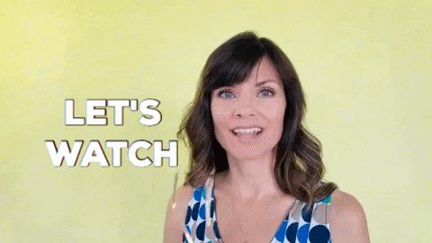 gif of a woman saying 'let's watch' to the camera