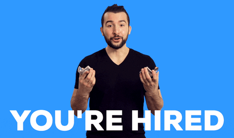 gif of a person saying 'you're hired' to the camera