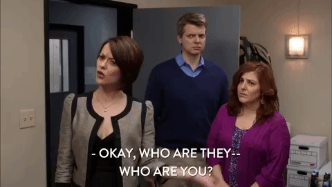 gif of a woman saying 'okay who are they? who are you?'