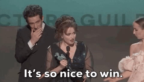 gif of Helena Bonham Carter accepting an award and saying 'it's so nice to win'
