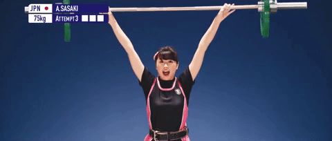 gif of a woman happily lifting weights