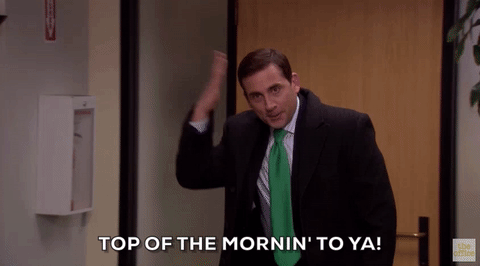 gif of Michael Scott walking into the office and saying 'top of the mornin to ya'