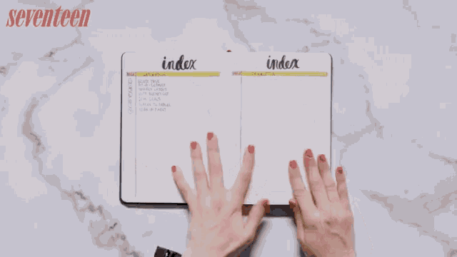 gif of a person's hand flipping through a notebook